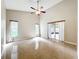 The living room is open and spacious, with tile flooring, neutral walls, and natural light at 2489 Tommys Turn, Oviedo, FL 32766