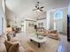 Open-concept living room featuring neutral tones, ample natural light and modern furnishings at 2489 Tommys Turn, Oviedo, FL 32766