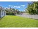 Spacious backyard with lush green lawn and a privacy fence, perfect for outdoor activities at 2782 Cedar Knoll Dr, Apopka, FL 32712