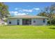 Expansive backyard featuring a screened lanai and a well-maintained lawn, ideal for outdoor entertaining at 2782 Cedar Knoll Dr, Apopka, FL 32712