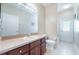 Well-lit bathroom featuring tile floor, vanity, toilet and walk in shower at 2782 Cedar Knoll Dr, Apopka, FL 32712