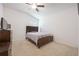 Cozy bedroom with vaulted ceiling, ceiling fan, neutral carpet and large dresser with television at 2782 Cedar Knoll Dr, Apopka, FL 32712