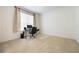 Bright bedroom with a modern desk and natural light from a window with vertical blinds at 2782 Cedar Knoll Dr, Apopka, FL 32712
