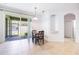 Dining room with tiled flooring, backyard views, and access to the patio at 2782 Cedar Knoll Dr, Apopka, FL 32712