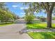 Charming home features a well-manicured lawn and an expansive paver driveway leading to a two-car garage at 2782 Cedar Knoll Dr, Apopka, FL 32712