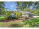 Charming home with well-maintained landscaping, blue shutters, and mature trees at 2782 Cedar Knoll Dr, Apopka, FL 32712