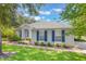Charming home with well-maintained landscaping, blue shutters, and mature trees at 2782 Cedar Knoll Dr, Apopka, FL 32712