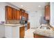 A modern kitchen featuring granite countertops, stainless steel appliances, and sleek wood cabinets at 2782 Cedar Knoll Dr, Apopka, FL 32712