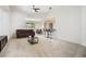 Bright living room with a vaulted ceiling, bar seating, and open floor plan at 2782 Cedar Knoll Dr, Apopka, FL 32712