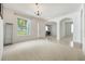 Bright living room with neutral carpet and tile flooring, offering a versatile living space at 2782 Cedar Knoll Dr, Apopka, FL 32712