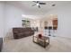 Open living space featuring a sofa, bar seating, and view of dining area at 2782 Cedar Knoll Dr, Apopka, FL 32712
