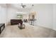 Bright living room with a vaulted ceiling, bar seating, and open floor plan at 2782 Cedar Knoll Dr, Apopka, FL 32712