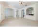 Open-concept living area with archways, tile flooring, and neutral tones creating a spacious feel at 2782 Cedar Knoll Dr, Apopka, FL 32712
