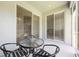 Screened patio with a table and chairs with access to the home's interior at 2782 Cedar Knoll Dr, Apopka, FL 32712