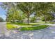 Well-maintained property on a corner lot with lush landscaping and mature trees providing shade at 2782 Cedar Knoll Dr, Apopka, FL 32712