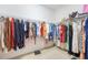 Spacious walk-in closet filled with colorful clothing and storage racks at 2782 Cedar Knoll Dr, Apopka, FL 32712
