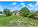 Charming brick home with well-maintained landscaping, lush greenery, and a welcoming facade at 295 Maguire St, Deltona, FL 32725