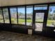 Enclosed sunroom with large windows offering views of the backyard at 3021 Norvell Ct, Deltona, FL 32738