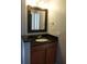 Bathroom with a single sink vanity and decorative mirror at 3024 S Semoran Blvd # 7, Orlando, FL 32822