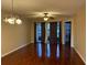 Living room boasting wood floors, a ceiling fan and sliding glass doors at 3024 S Semoran Blvd # 7, Orlando, FL 32822