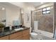 Bathroom features a granite countertop, framed mirror, and tiled shower/tub combo at 3426 Cocard Ct, Windermere, FL 34786