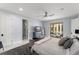 Airy bedroom featuring a TV, direct access to a bathroom, and outdoor access at 3426 Cocard Ct, Windermere, FL 34786
