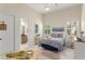 Nautical-themed bedroom with coastal decor, shutters, and a view of the bathroom at 3426 Cocard Ct, Windermere, FL 34786