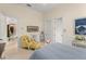 Bright bedroom with a yellow patterned armchair and a nautical theme throughout the room at 3426 Cocard Ct, Windermere, FL 34786