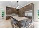 Well-appointed kitchen with a large island, custom cabinetry, and stainless steel appliances at 3426 Cocard Ct, Windermere, FL 34786