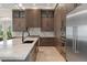 Beautiful kitchen featuring a large island, custom cabinets, and stainless steel appliances at 3426 Cocard Ct, Windermere, FL 34786