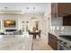 Open-concept kitchen with a large center island, stainless appliances, and easy access to dining and living areas at 3426 Cocard Ct, Windermere, FL 34786