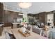 Modern kitchen with stainless steel appliances, a large island, and adjacent wine bar at 3426 Cocard Ct, Windermere, FL 34786