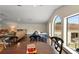 Large living space with hardwood floors, dining area, sofas, and large windows at 3426 Cocard Ct, Windermere, FL 34786