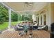 Outdoor living space with a covered patio, an outdoor kitchen, and comfortable seating areas at 3426 Cocard Ct, Windermere, FL 34786