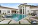 Incredible backyard pool with travertine decking, splash pad, and a well maintained lawn at 3426 Cocard Ct, Windermere, FL 34786