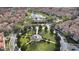 Community aerial view featuring a central park, mature trees, and well-maintained terracotta roofs at 3508 Porta Romano Way, Lake Mary, FL 32746