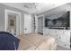 Cozy bedroom with a dresser, TV and access to a bathroom and closet at 3508 Porta Romano Way, Lake Mary, FL 32746