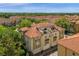 Exterior aerial view of a multi-story home featuring a private balcony, garages, and terracotta roof at 3508 Porta Romano Way, Lake Mary, FL 32746