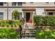Well-manicured front entrance with steps leading to the front door and lush landscaping at 3508 Porta Romano Way, Lake Mary, FL 32746
