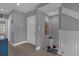 Second-floor hallway with hardwood flooring and access to the staircase at 3508 Porta Romano Way, Lake Mary, FL 32746