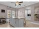 Bright kitchen with large island, white cabinets, and sleek design at 3508 Porta Romano Way, Lake Mary, FL 32746