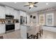 Well-equipped kitchen featuring stainless appliances, granite countertops, white cabinets, and kitchen island at 3508 Porta Romano Way, Lake Mary, FL 32746