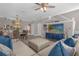 Open living space features a dining area, and sofa with blue accent pillows at 3508 Porta Romano Way, Lake Mary, FL 32746