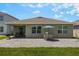 Home exterior view showcasing large backyard and covered patio at 3936 Silverstream Ter, Sanford, FL 32771