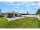 Spacious backyard with patio, umbrella, and ample green space at 3936 Silverstream Ter, Sanford, FL 32771