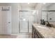 Bathroom featuring a glass-enclosed shower, granite countertop, and tile flooring at 3936 Silverstream Ter, Sanford, FL 32771