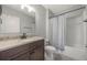 Well-lit bathroom with granite countertop vanity, modern fixtures, and a bathtub at 3936 Silverstream Ter, Sanford, FL 32771