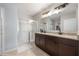 Bathroom featuring a double vanity with granite countertops and a glass-enclosed shower at 3936 Silverstream Ter, Sanford, FL 32771