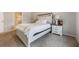 Comfortable bedroom with a nice bed, matching bedside tables, and soft carpet at 3936 Silverstream Ter, Sanford, FL 32771