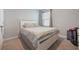 Bright bedroom featuring a queen-sized bed and neutral decor at 3936 Silverstream Ter, Sanford, FL 32771